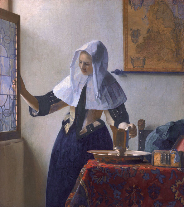 Young Woman with a Water Pitcher by Johannes Vermeer in the Metropolitan Museum of Art in New York