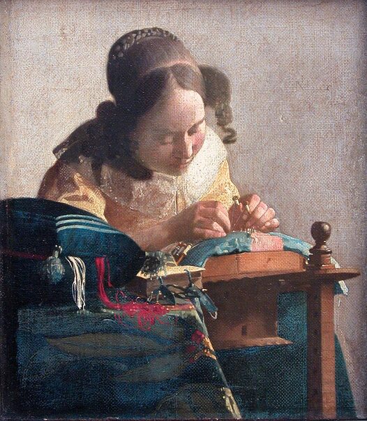 The Lacemaker by Johannes Vermeer in the Louvre Museum in Paris